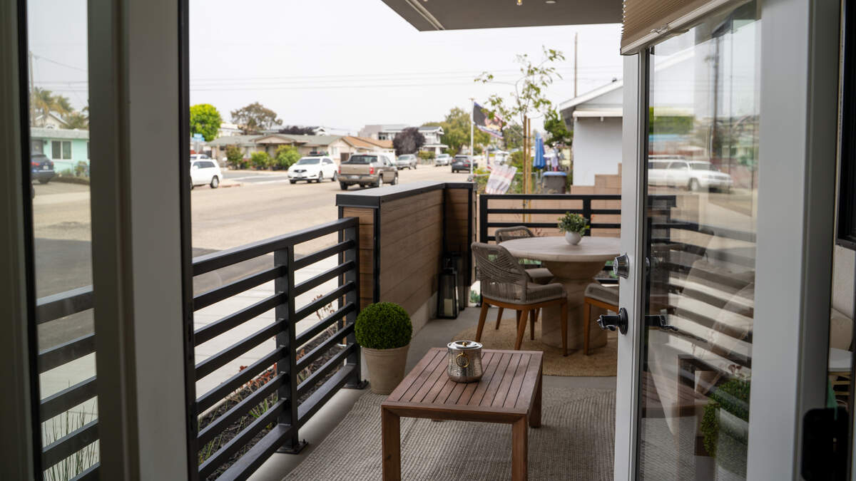The patio of a ground floor unit in the 59-unit “Encore” development looks out on 4th Street during the development’s grand opening on June 13, 2026. Visitors were invited to tour the lobby, rooftop, units and amenities of both buildings.