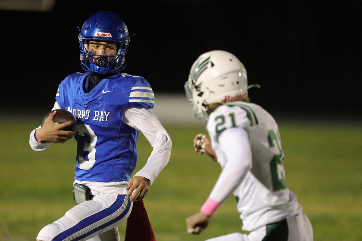 Nicky Johnson is pursued by Kolton Sobyra. Templeton Eagles beat the Morro Bay Pirates 27-9.