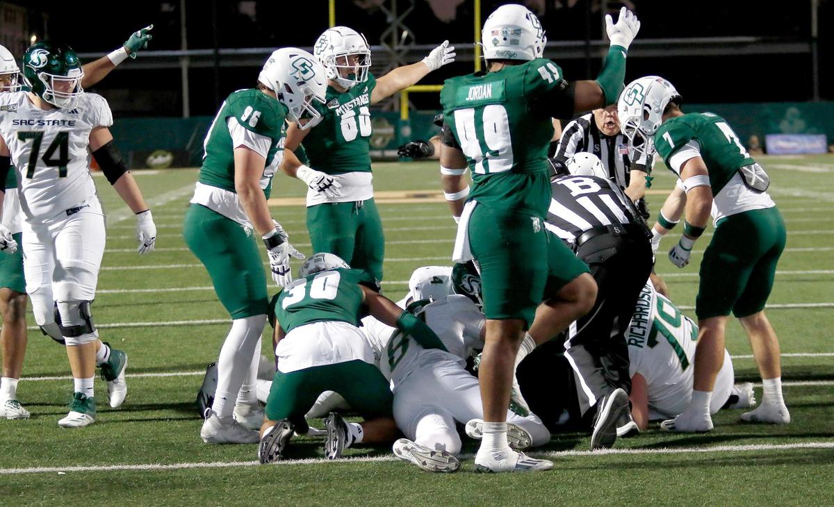 Sacramento State fumbles the ball at the 1-yard line and Cal Poly takes possession with one minute left in the game. Cal Poly beat Sacramento State 26-23 in a college football game at Mustang Memorial Field on Nov. 16, 2024.