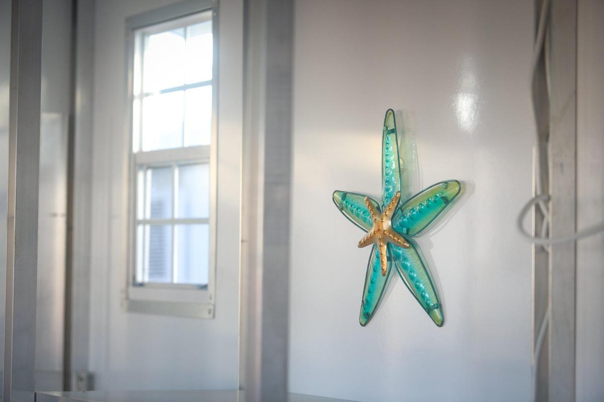 Ocean-theme art adorns the walls of the 5Cities Homeless Coalition’s Cabins for Change shelters in Grover Beach.