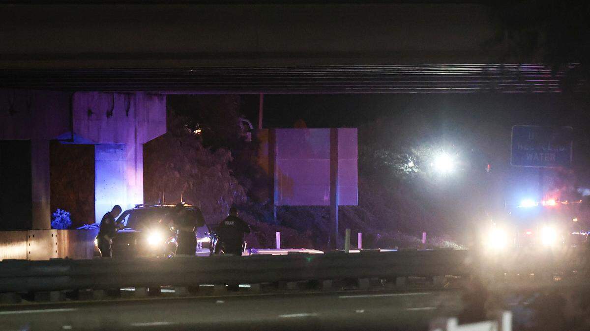 San Luis Obispo police investigate at the Madonna Road highway overpass. They were among the law enforcement who responded to an incident on Highway 101 northbound at the Madonna Road overpass.