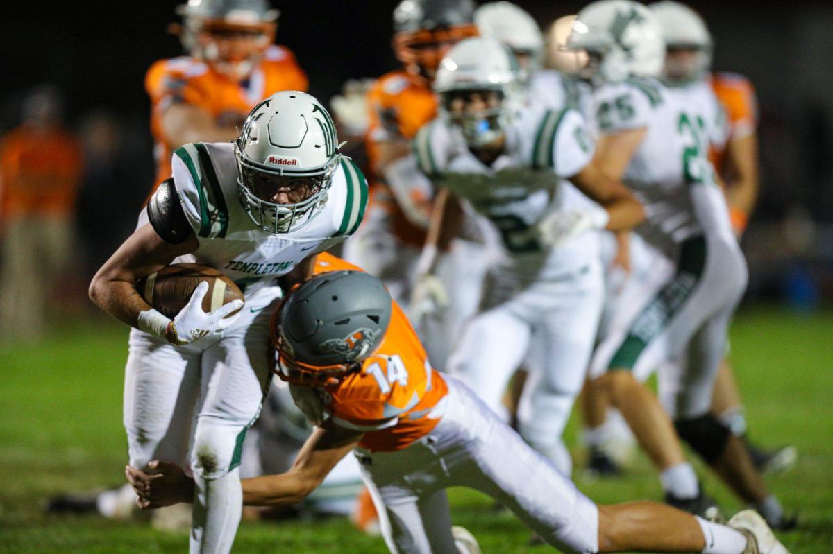 Jan Martinus runs as Mason Degnan makes a tackle. The Atascadero Greyhounds beat the Templeton Eagles 27-21. Atascadero high School hosted Templeton in Ocean League football on Oct. 7, 2022.