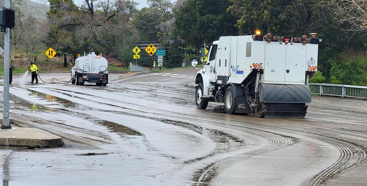 San Luis Obispo city crews worked to clear mud and debris from the intersection of Marsh and Higuera Streets on Tuesday morning, Jan. 10, 2023.
