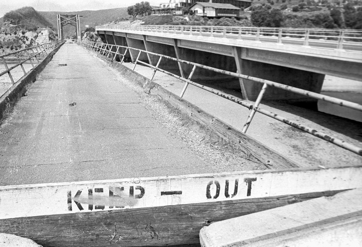 Built in 1881 the Pacific Coast Railway Bridge No. 5 was condemned and closed when it was photographed here June 26,1976. There was a proposal to use it with a bike trail but funding never was found. It collapsed in 1981. Recent storms have exposed the footings for the bridge over San Luis Creek.