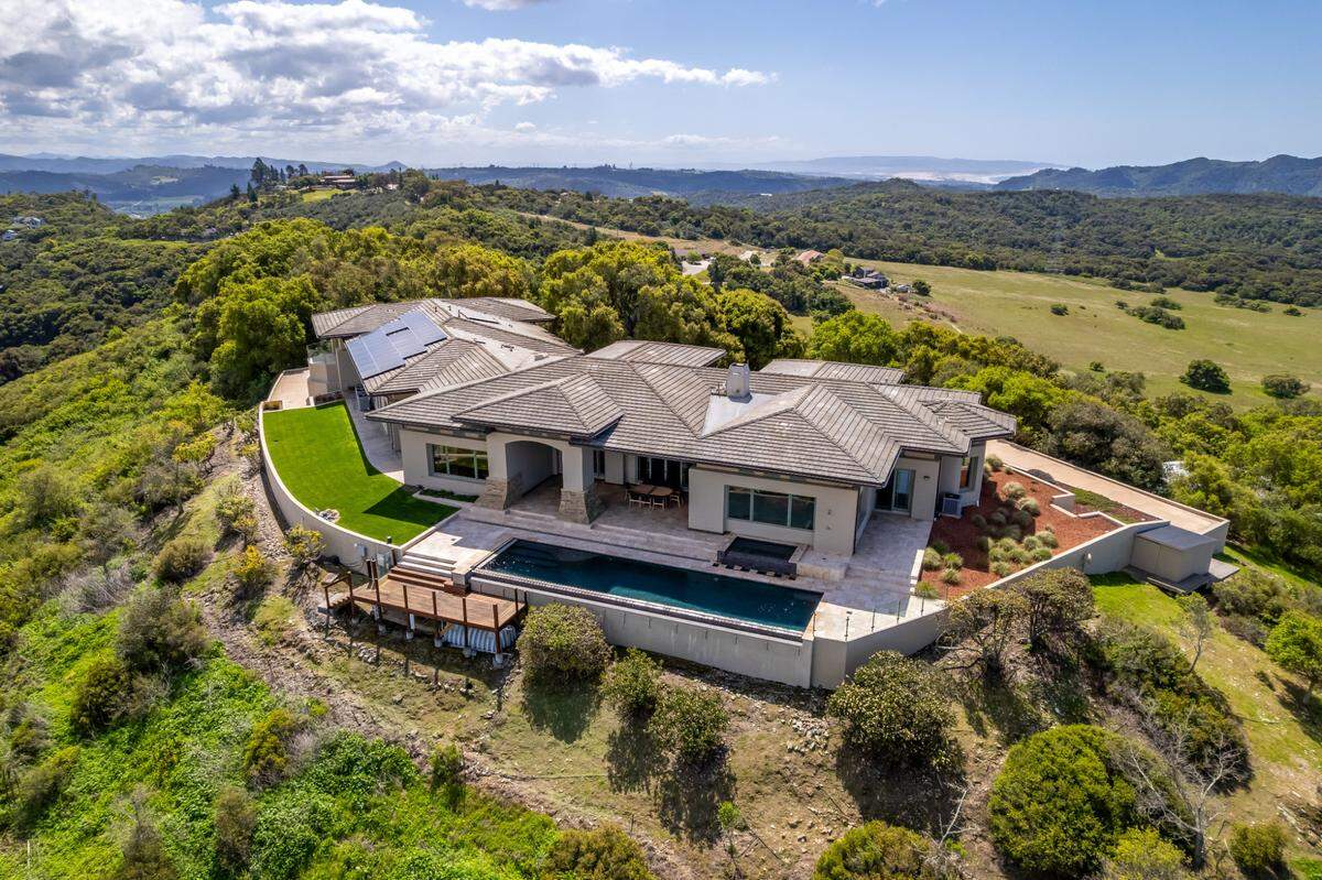 Quail Haven Hill, a six-bedroom, six-bathroom home featuring a home theater, outdoor pool and koi pond, went up for sale at $8.2 million Tuesday, April 8, 2025. The home features a blend of traditional Chinese and Greene and Greene architectural influences.