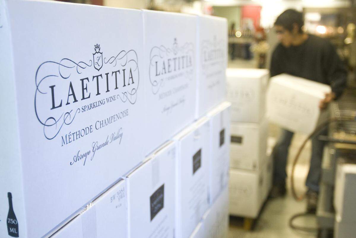 Kevin Cabrales loads cases of bottles on a pallet at Laetitia Vineyard and Winery in Arroyo Grande.
