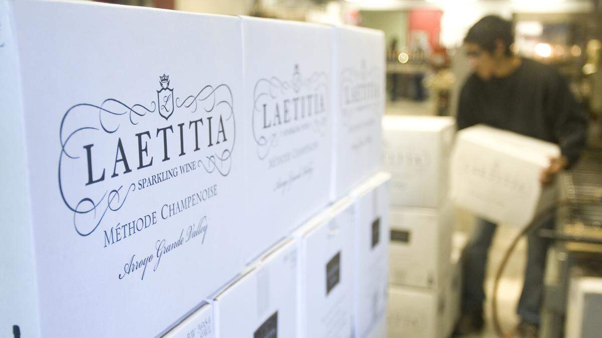 Kevin Cabrales loads cases of bottles on a pallet at Laetitia Vineyard and Winery in Arroyo Grande in 2013.