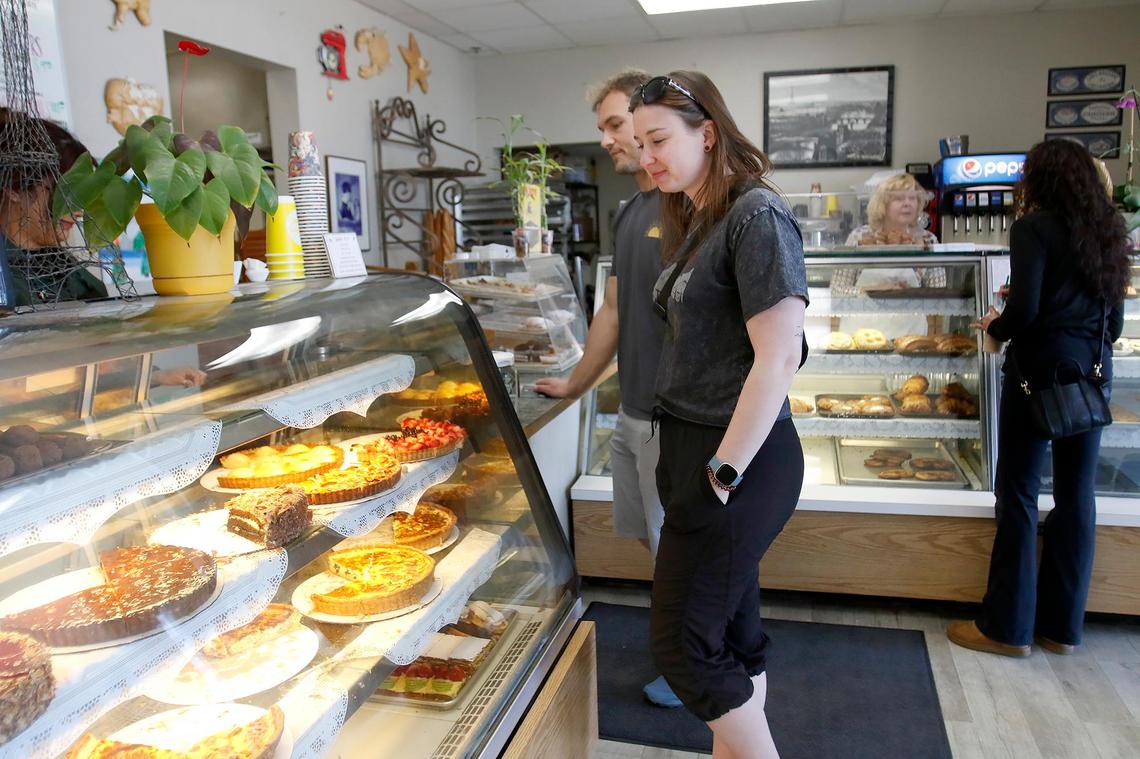Emma Robertson and Gunnar Andersen, visiting Morro Bay from Canada, glance at the delectable pies and quiches as they contemplate what to order. La Parisienne in Morro Bay is a French bakery is serving up flaky pastries, iced cookies and hearty sandwiches, all at an affordable price for locals and tourists alike.