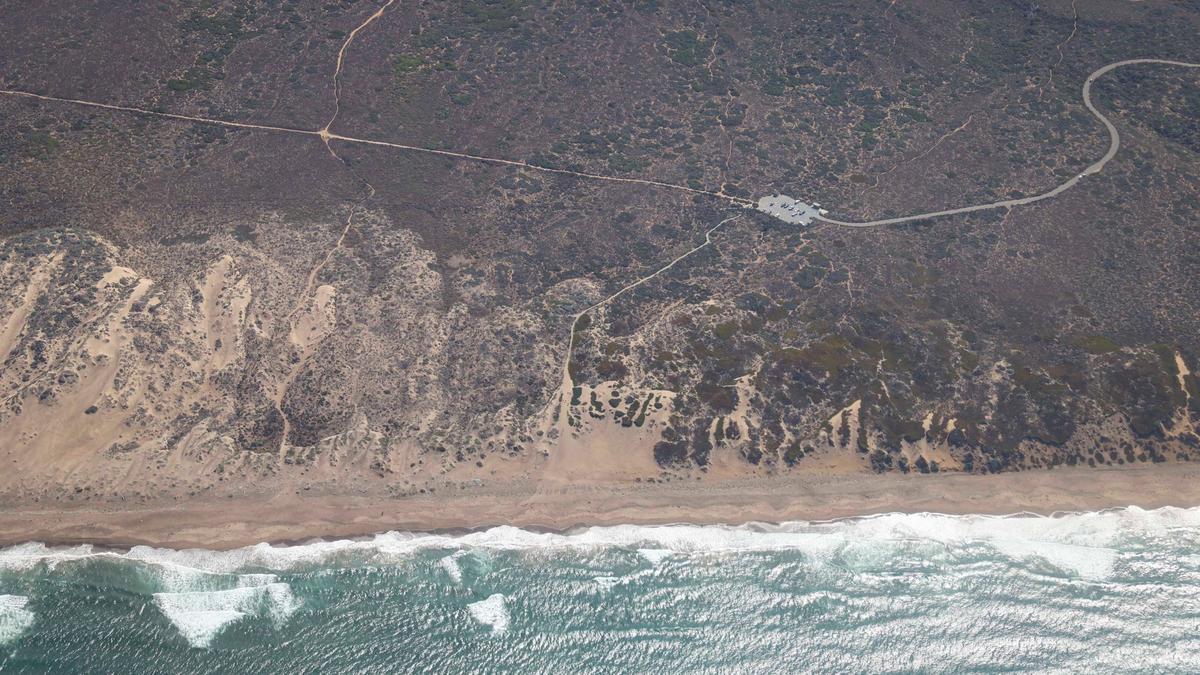 An aerial view of Montaña de Oro State Park, with the parking lot at the end of Sand Spit Road. The Northern Chumash Tribal Council organized an aerial tour of lands bordering the Chumash Heritage National Marine Sanctuary on Sept. 18, 2024. The flight was sponsored by EcoFlight, a nonprofit dedicated to appreciation of the environment.