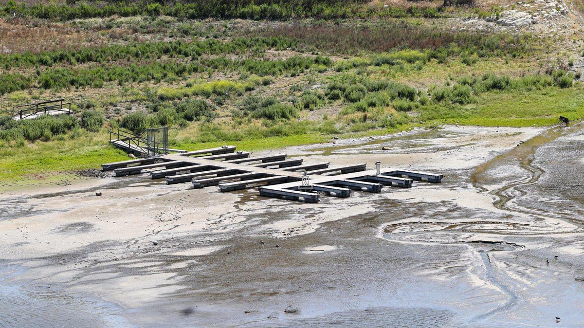 A dock at the upper reaches of Lopez Lake near Arroyo Grande is about to be left high and dry as only a trickle of water flows into the lake due to drought. Many south San Luis Obispo County towns rely on Lopez Lake for most or all of their water; lake levels were at 25.9% on July 19, 2022.