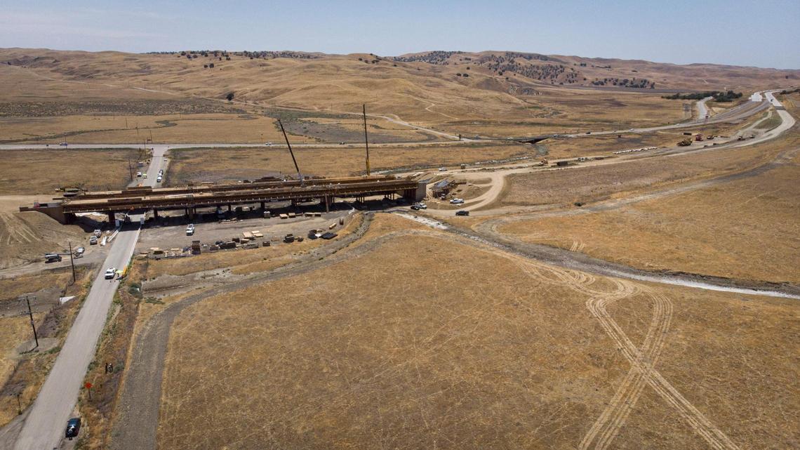 New highway in foreground, bridging Cholame Valley Road to Parkfield, old existing highway in background. San Andreas Fault in upper left corner of photo. Construction continues on the new interchange at the Y where Highway 41 from Fresno meets Highway 46 between Paso Robles and Bakersfield, seen on June 3, 2025.