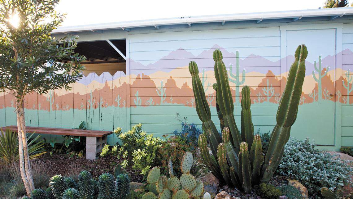 This Sonoran Desert mural, painted by Philip Carey, adds another dimension to his cactus and succulent garden. See more photos of the garden >>