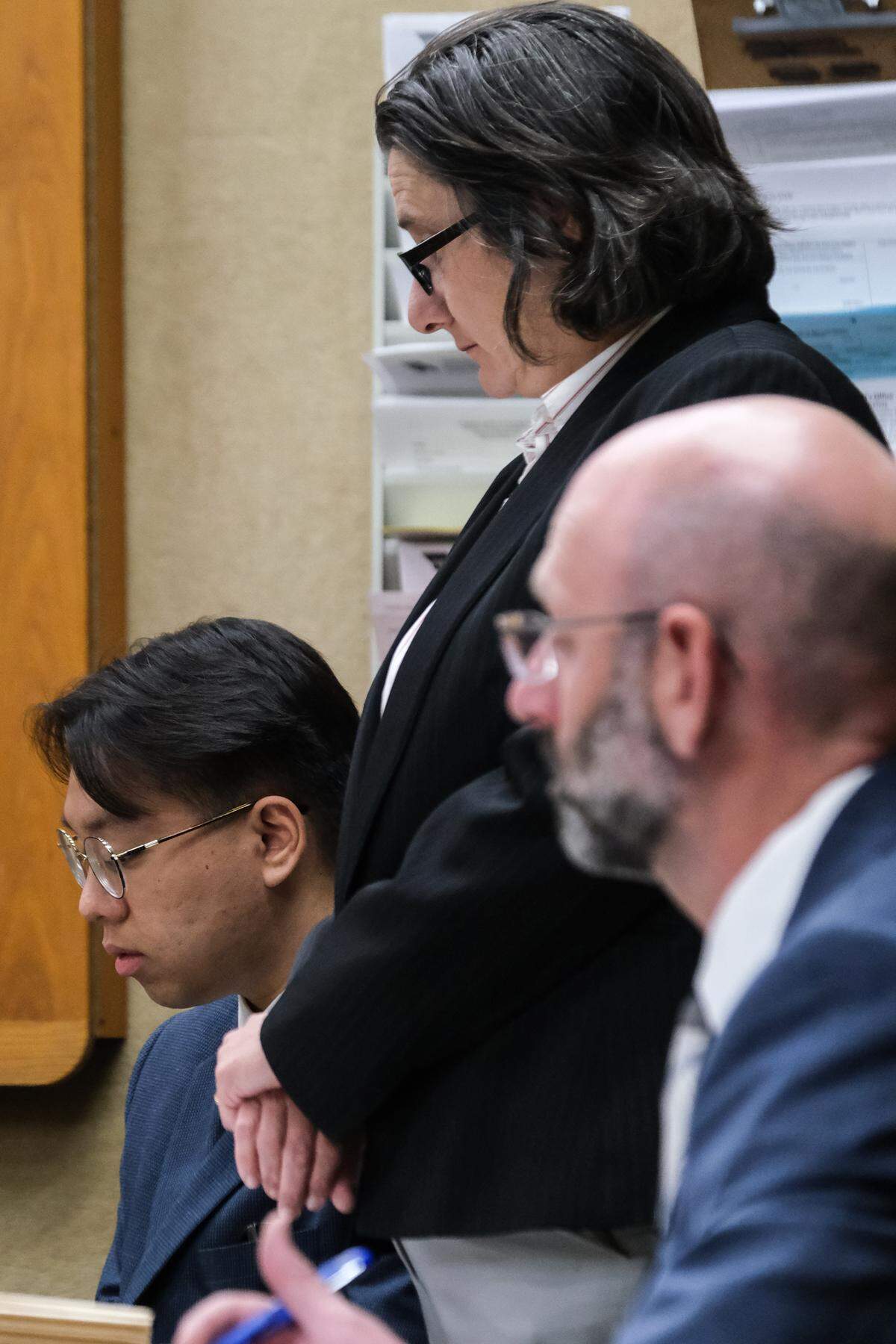 Brandon Pham, left, attends his sentencing hearing with his attorney, Adrienne Haddad, center, and San Luis Obispo County Deputy District Attorney Ben Blumenthal in San Luis Obispo Superior Court on Sept. 18, 2024. Pham pleaded guilty to having multiple guns on Cal Poly campus and was sentenced to 210 days in jail, two years of probation and 60 hours of community service.