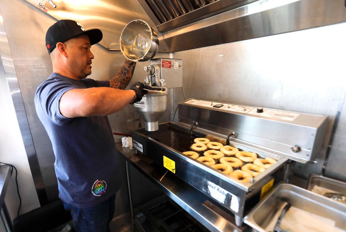 Ben and Jessica Brown acquired a shuttered former fish smokehouse in Cayucos and transformed it into a new, eye-catching doughnut shop Surf Rats Donuts. Ben Brown is the chief doughnuts maker.