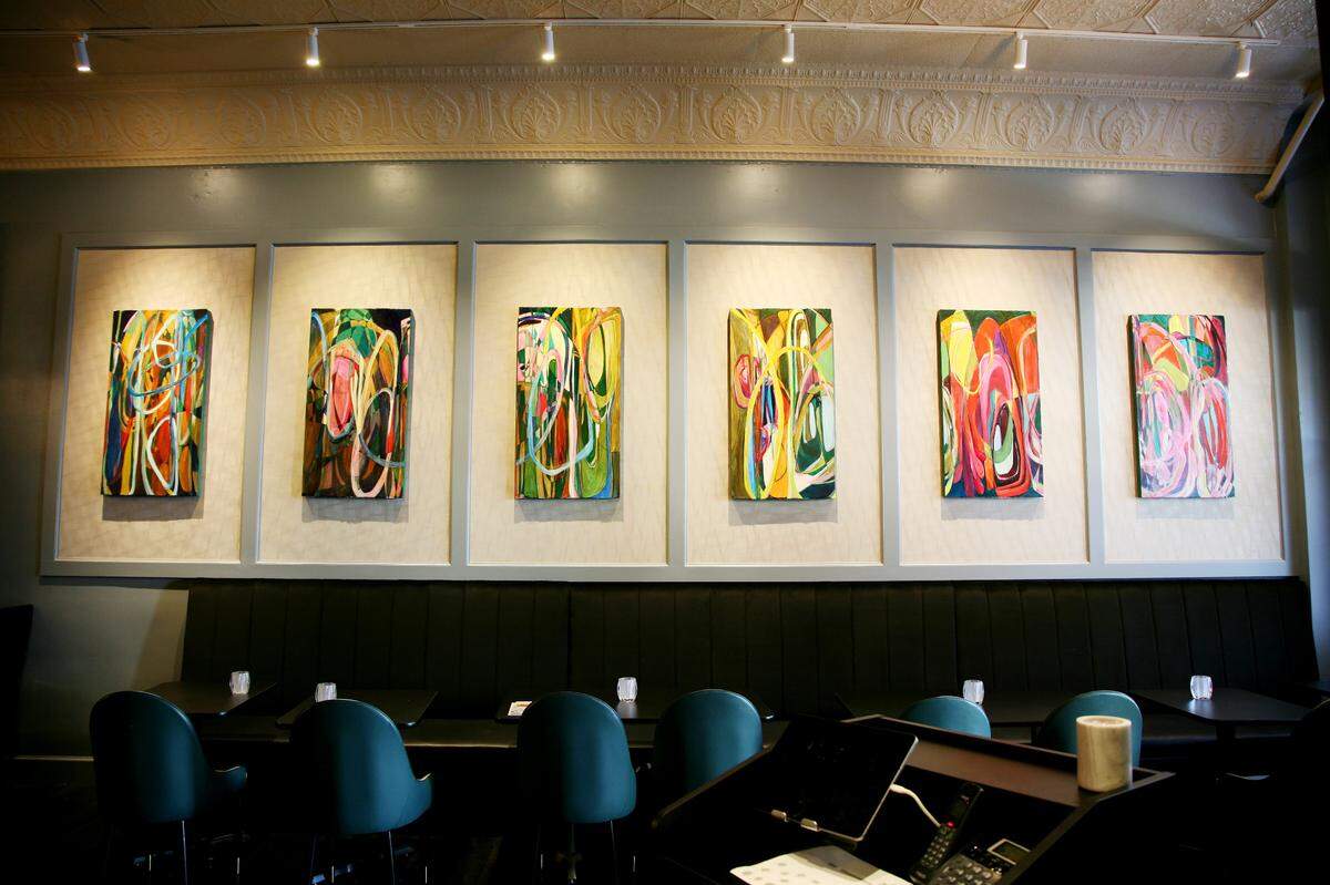 Artwork by local artist Amy Holland covers the side wall of Parchetto as guests enter the restaurant.