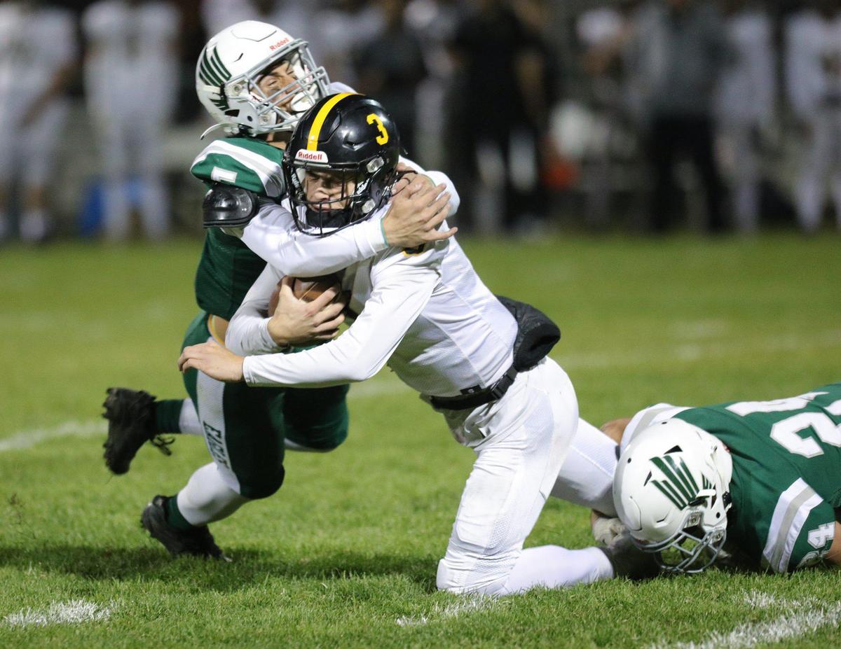 Braden Mott, left, and Lane Miller bring down Jace Gomes in San Luis Obispo’s 17-14 win over Templeton on Oct. 27, 2023, in the last game of the Ocean League’s regular football season.