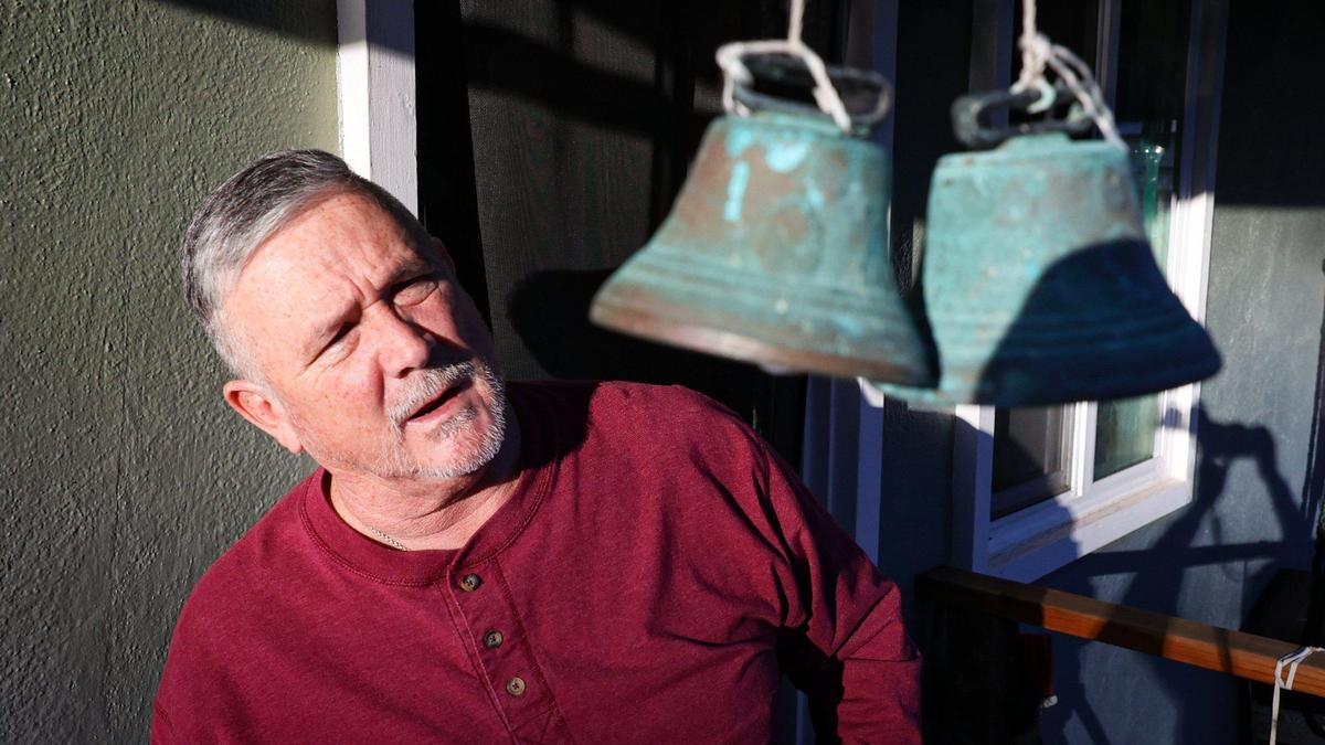 Chuck Gonzales looks at bells, a gift from one of the people he and his wife Sandra have taken care of. Sandra and Chuck Gonzales, have been caregivers in the Cambria area who’ve had to move four times in five years.