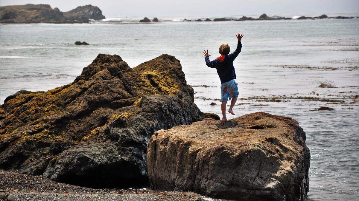 Sean Lindsey enjoys a day on a rocky central California rocky coastline.