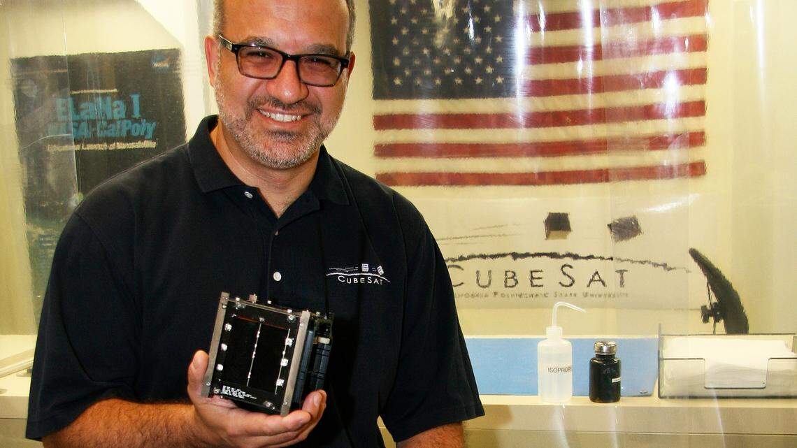 Cal Poly professor Jordi Puig-Suari holds a CubeSat. Since he and Stanford professor Bob Twiggs created the CubeSat, thousands have been sent to space by students, private businesses and governments.