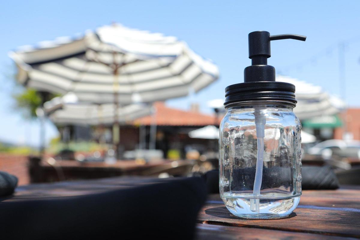 Taste Restaurant on Broad Street has expanded its outdoor seating options since indoor dining is no longer allowed. Hand sanitizer is part of the table decor in the era of coronavirus.