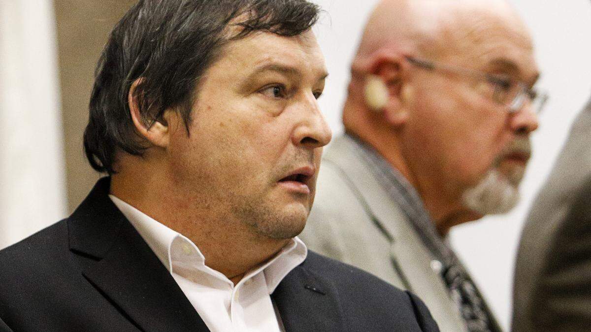 Mark Andrews, left, was in court Feb. 6 for a murder trial in the shooting death of his neighbor, Colleen Barga-Milbury. At right is his attorney, Ilan Funke-Bilu.