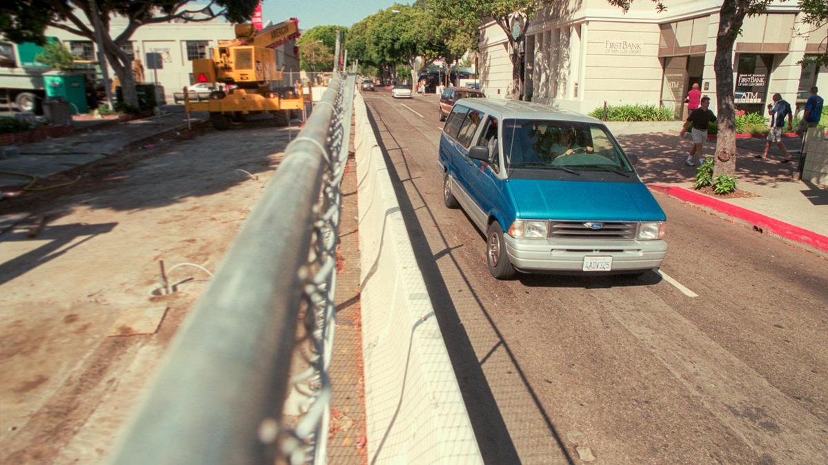 Workers prepare to dig down to San Luis Creek on Higuera Street July 10, 2000. They were starting the “Little Dig” a $1.9 million replacement of the Higuera Street Bridge over San Luis Creek. The bridge was a century old and crumbling.