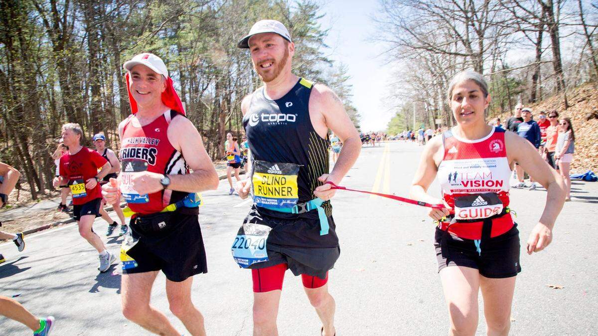 Kyle Robidoux, center, is presenting at the U.S. Trailrunning Conference on Thursday in San Luis Obispo. The 42-year-old Robidoux, who is legally blind, will run the SLO Ultra 50k Saturday morning.