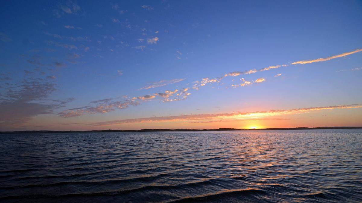 A pretty sunset under clear skies over Morro Bay as viewed from Baywood Park.