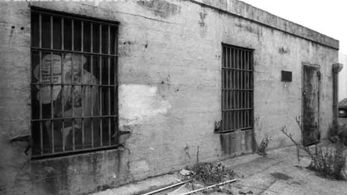 Shoe advertisement hides behind bars of San Luis Obispo's old jail behind Charles Shoes on Higuera Street.