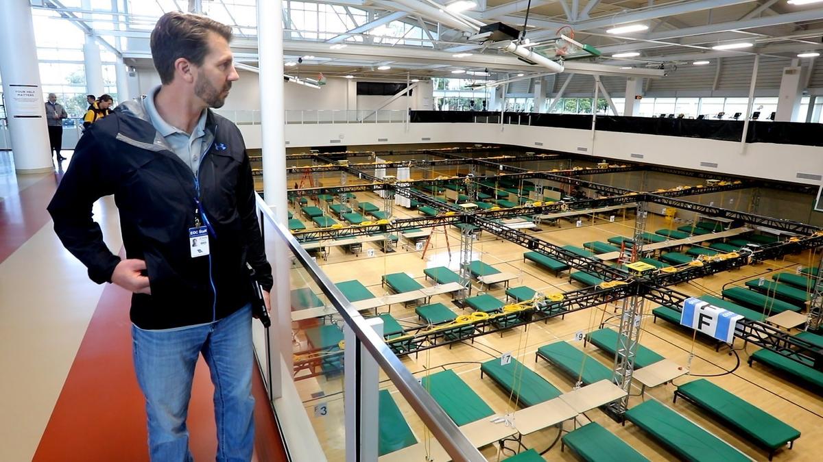 San Luis Obispo County Public Works Interim Director John Diodati looks over the Phase I area of the alternate care site at the Cal Poly Rec Center as workers prep the facility for COVID-19 patients.