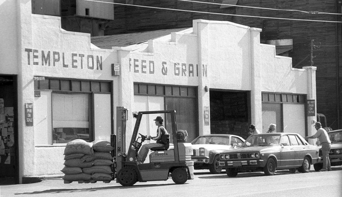 A fork lift operator moves bags at Templeton Feed & Grain on Feb. 17, 1989.