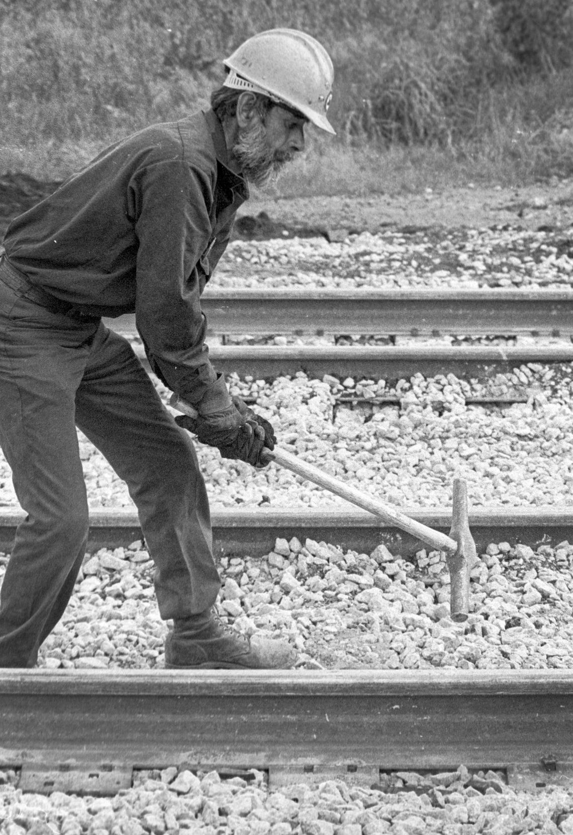 Robert M. Gonzales swings his spike maul while repairing Southern Pacific railroad track in San Luis Obispo on March 12, 1984.
