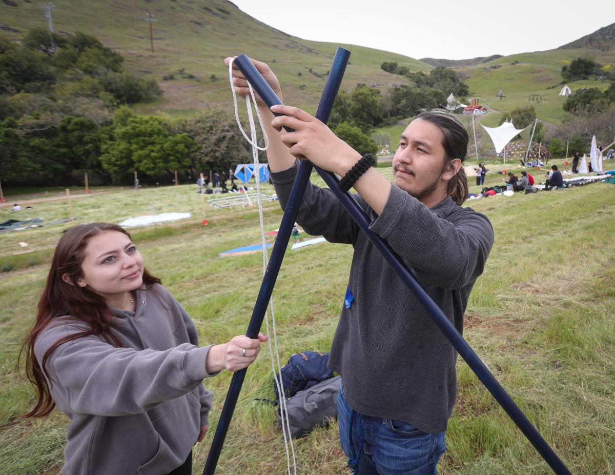 Leslie Sanchez and Jonathan Diaz with El Camino Community College tie components together. Architecture students from throughout the west came to Poly Canyon participate in Design Village on the Cal Poly campus on April 25, 2025.