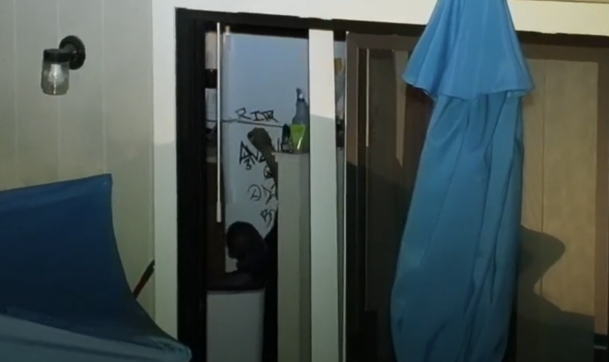 A drone captures Steven Adam Calderon writing “RIP” on the refrigerator during the standoff at Dry Creek Apartments in Paso Robles on July 6, 2021. Calderon was killed by police when he later appeared to reach for his gun while sitting on the stairs outside.