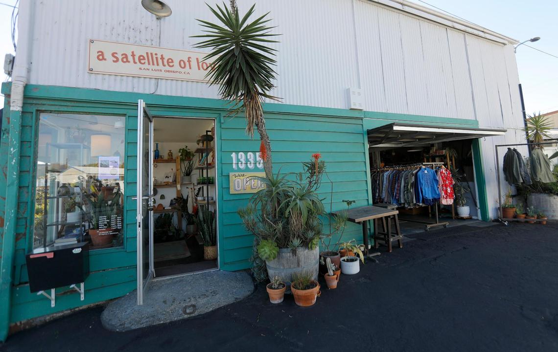 Racks of vintage clothing in Satellite of Love on Walker Street in San Luis Obispo. Vintage shops in downtown SLO buy and sell high-quality secondhand clothing and accessories.