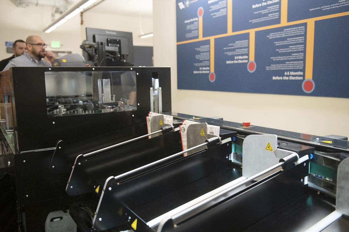 The Agilis machine sorts and slices into mail-in ballot envelopes. The new system was installed at the county elections office on Feb. 2, 2026.
