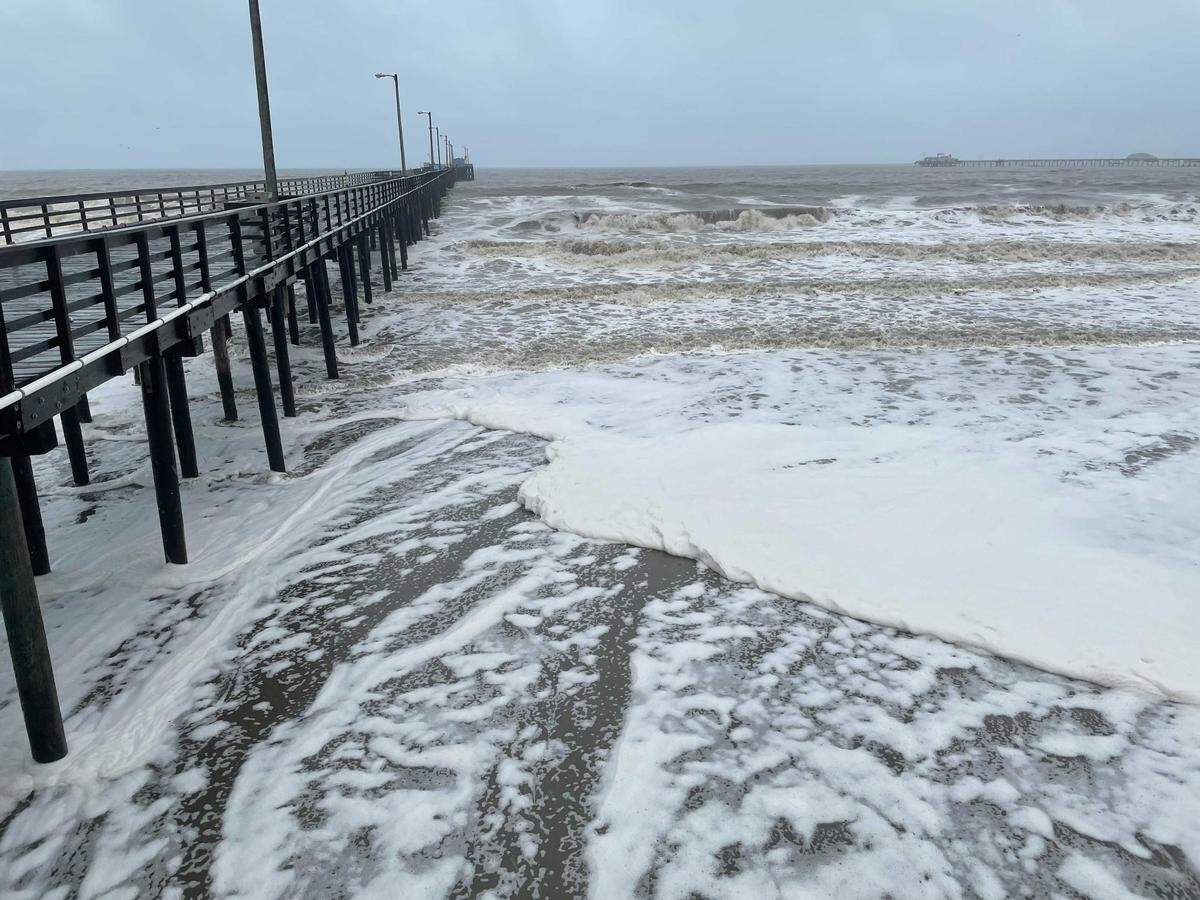 Foamy ocean waves roll beneath the Avila Beach Pier on Thursday, Jan. 27, 2021.