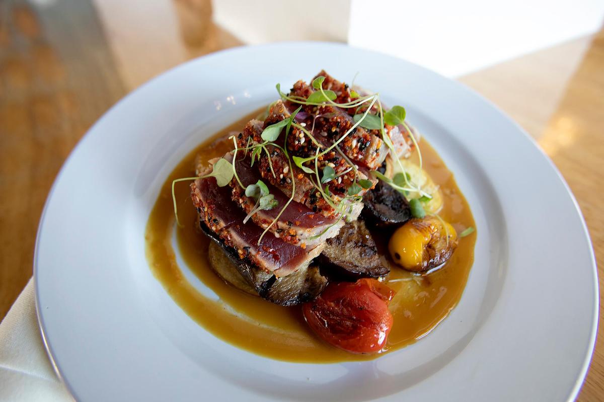 Shichimi-crusted ahi is served with fingerling potatoes, tomato eggplant ragu and blood orange ginger miso at Pono Pacific Kitchen in Grover Beach.