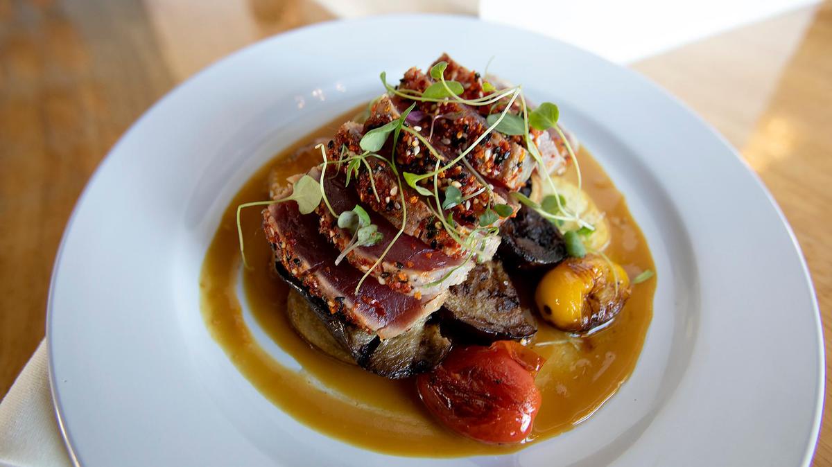 Shichimi-crusted ahi is served with fingerling potatoes, tomato eggplant ragu and blood orange ginger miso at Pono Pacific Kitchen in Grover Beach.