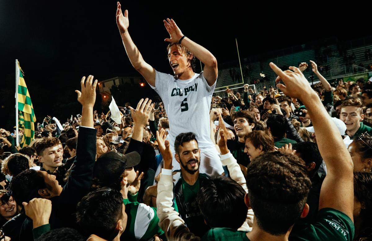 Cal Poly senior defender Nick Carroll celebrates with fans at Alex G. Spanos Stadium after the Mustangs beat UCSB 1-0 in front of a sellout crowd in their Blue-Green rivalry series opener Sunday, Sept. 30, 2018. Photo by Joe Johnston 09-30-18