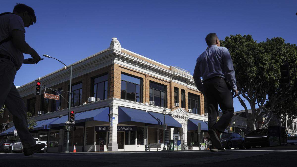 Pedestrians cross Chorro Street at Higuera Street in downtown San Luis Obispo on Oct. 27, 2025.