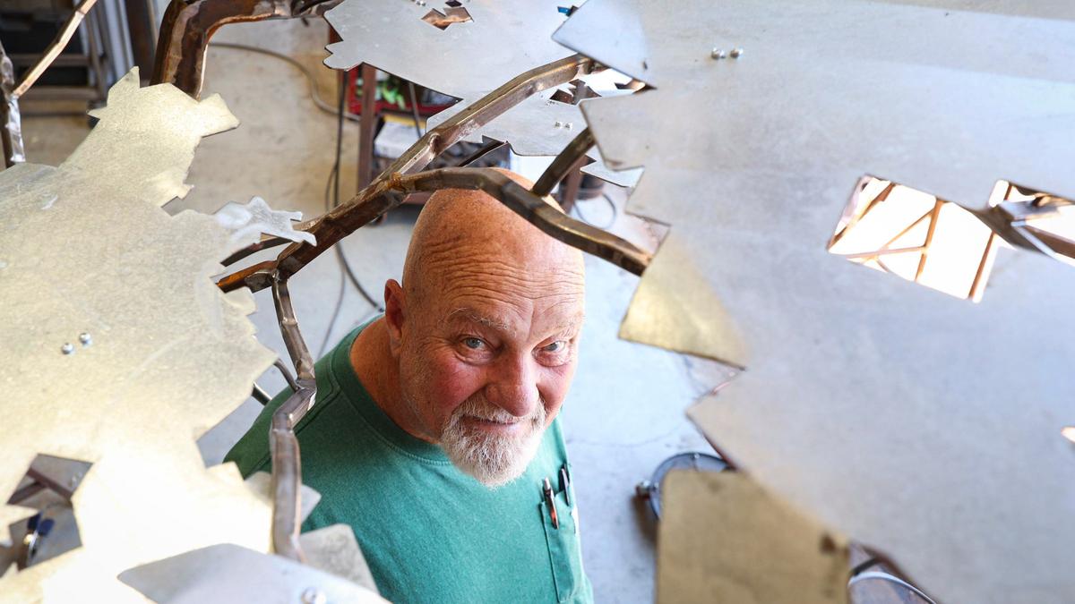 Allen Root, a metal artist seen here at his studio on July 10, 202, has been battling late-stage prostate cancer for nearly nine years while having difficulties finding specialists in San Luis Obispo County.
