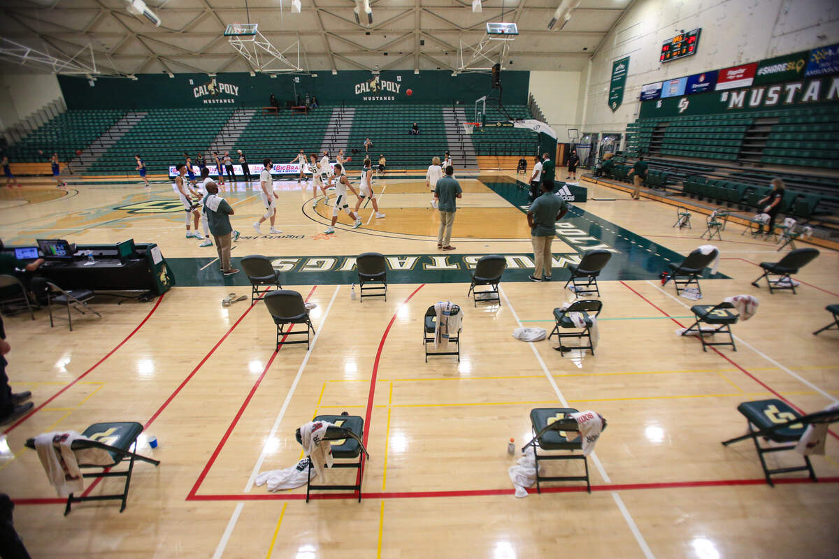 The Cal Poly men hosted hosting Bethesda College of Anaheim for the basketball home opener in November 2020. Fans were absent from the bleachers due to coronavirus restrictions and team seats were spaced out.