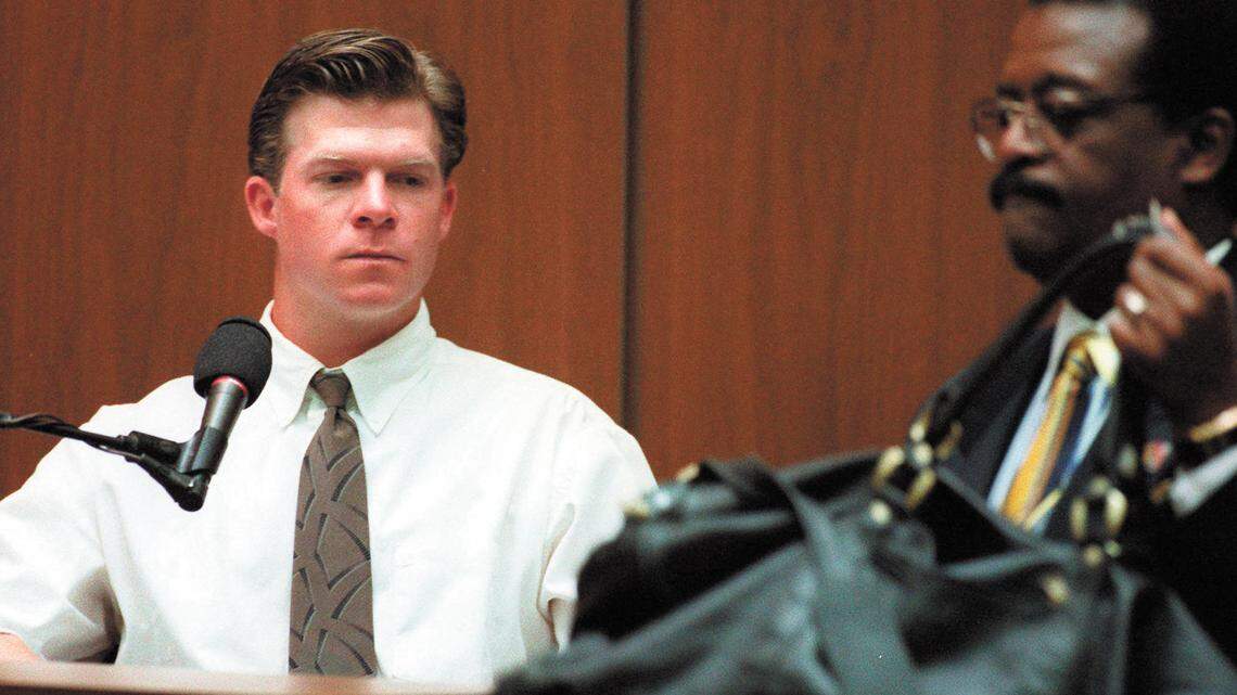 Allan Park, left, testifies while attorney Johnnie Cochran Jr. displays a bag during the O.J. Simpson double-murder trial in Los Angeles on March 29, 1995.