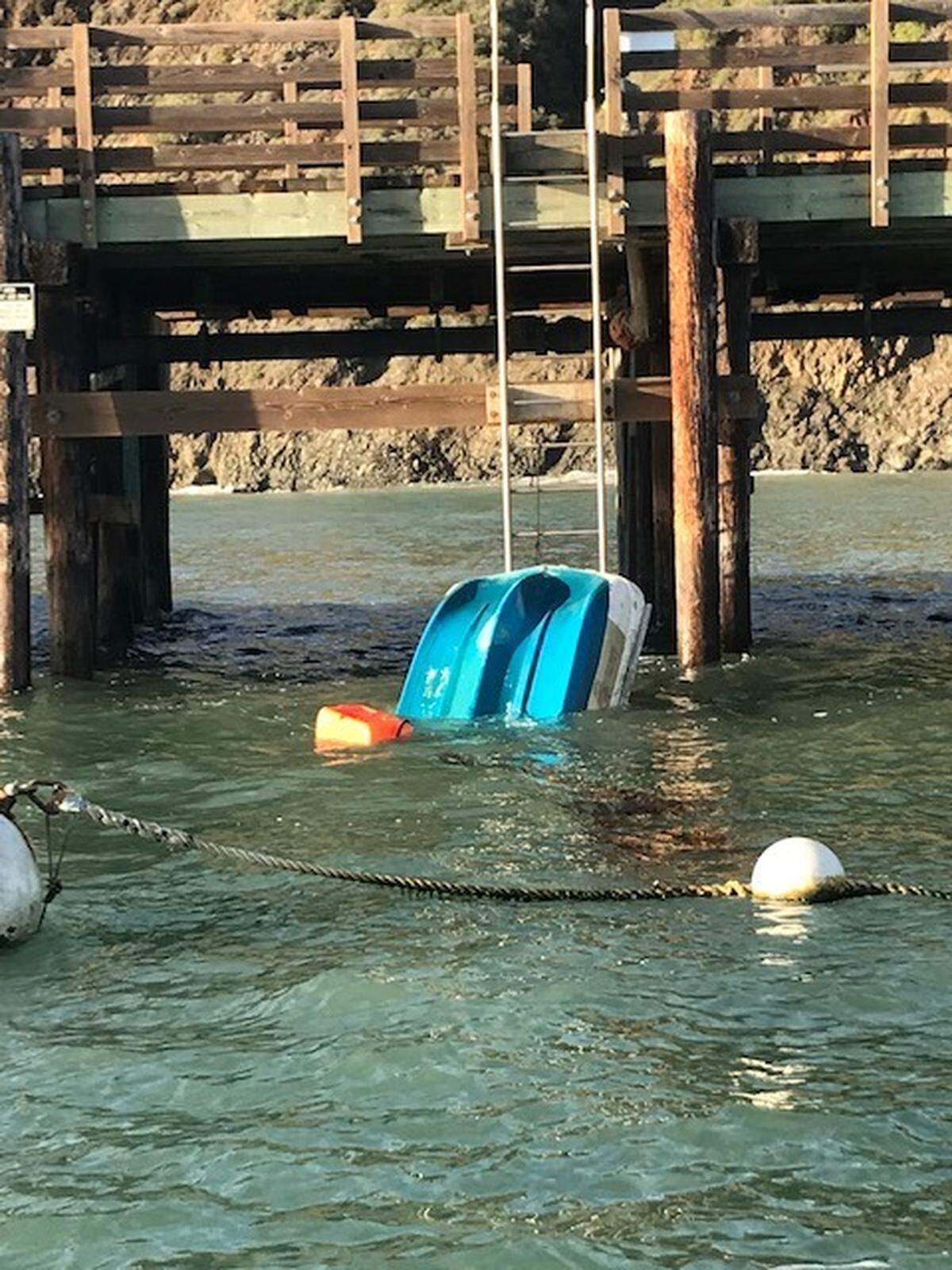 A skiff capsized in Port San Luis on Tuesday, possibly as a result of the large swell in the area, according to Matt Ashton, chief Harbor Patrol officer at the Port San Luis Harbor District.