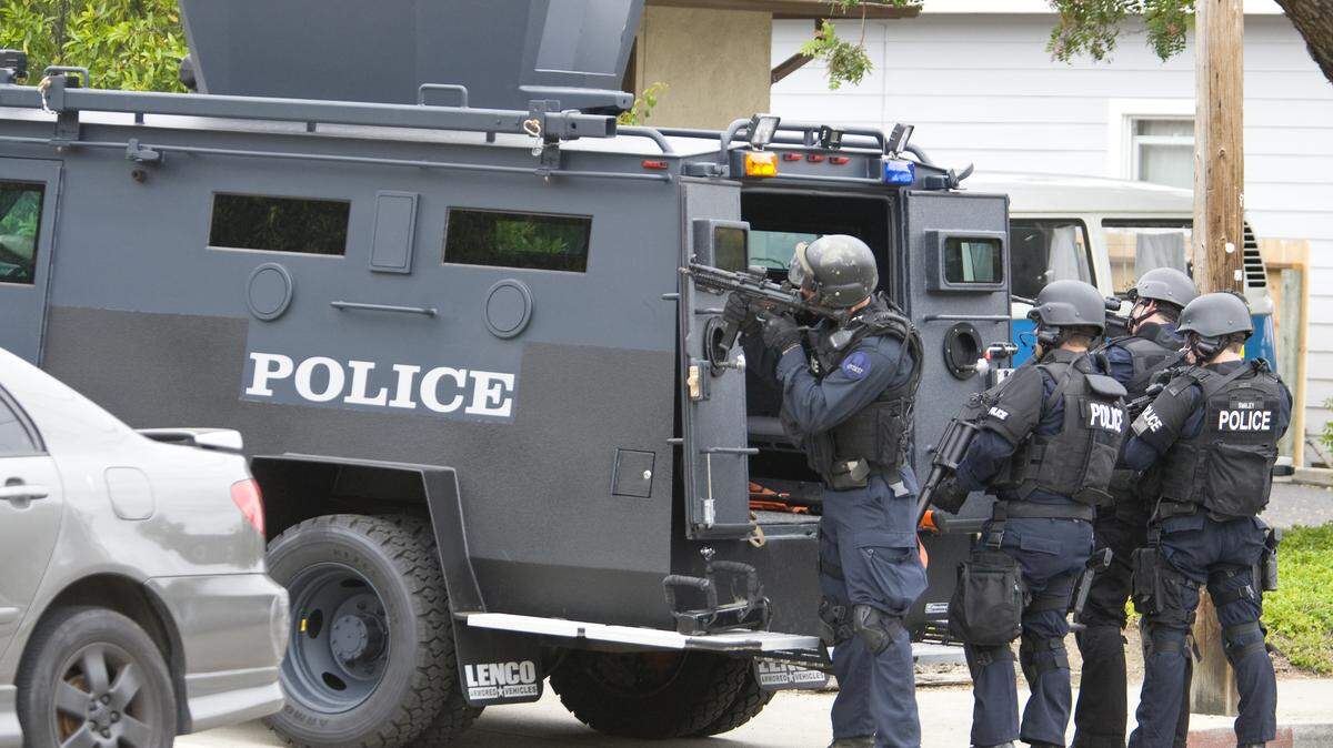 Members of the SWAT team respond to a May incident in San Luis Obispo using the Lenco BearCat, a midsize armored personnel carrier that the San Luis Obispo Police Department received in 2011. The SWAT team was called in after a man barricaded himself in an apartment on Stenner Street.