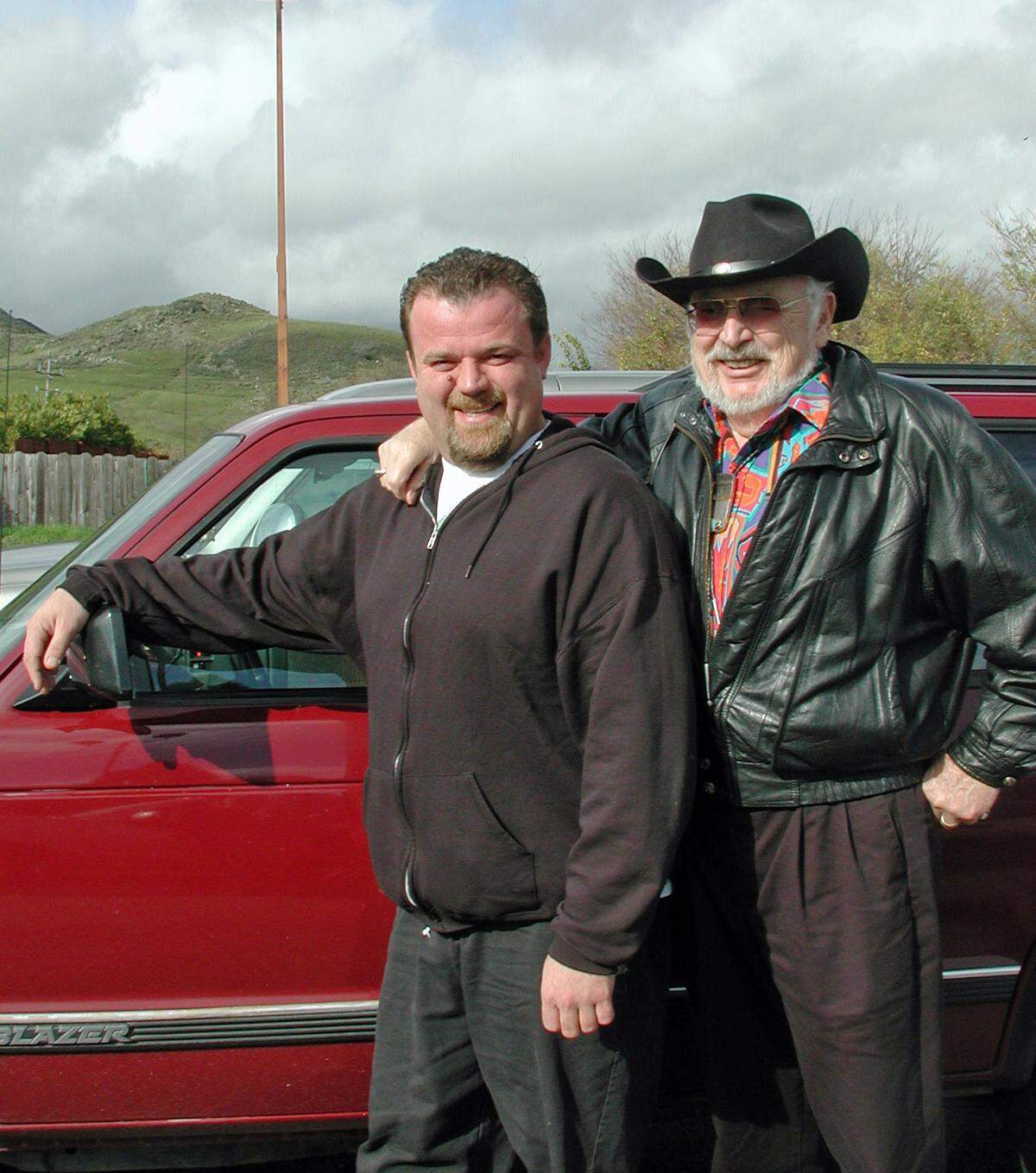 Happier-days photos like this one are helping Tribune columnist Kathe Tanner deal with the sudden death in June of son Brian Tanner, left, and her husband Richard Tanner in December 2020.