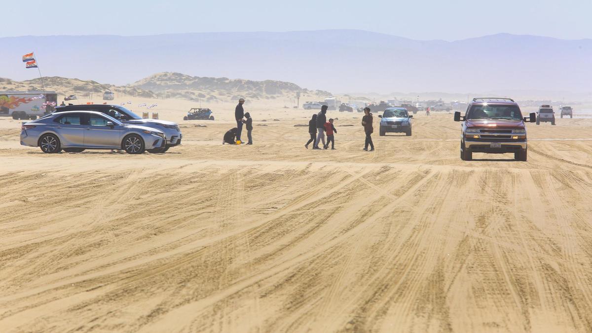 Cars on the Oceano Dunes south of Arroyo Grande Creek on March 22, 2021. A new agreement in December 2021 temporarily lifts a restriction preventing vehicles from crossing the creek any time it’s flowing to the ocean. Now, cars will be allows cars to cross as long as the water is no more than 12 inches deep. The Coastal Commission had voted to ban vehicle crossings of the creek if any amount of water flowed into the ocean.