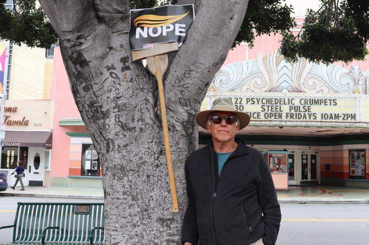 Cliff Ward of Los Osos attended the National Day of Prayer celebration on May 1, 2025 accidentally, thinking it was a protest against President Donald Trump. He stood off to the back with his protest sign observing the event.