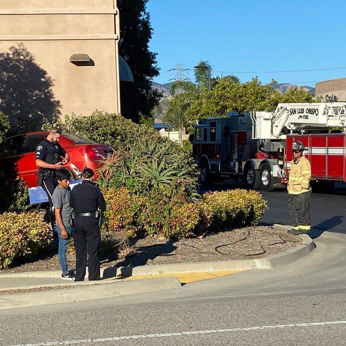 A red Kia car is seen after crashing into a bush near a business on Broad Street in San Luis Obispo on Tuesday, July 12, 2022. No one was injured.